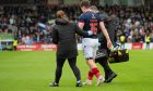 George Harmon was forced off injured against Dundee. Image: SNS