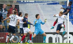 Akil Wright heads Ross County ahead against Dundee. Image: Paul Devlin/SNS.