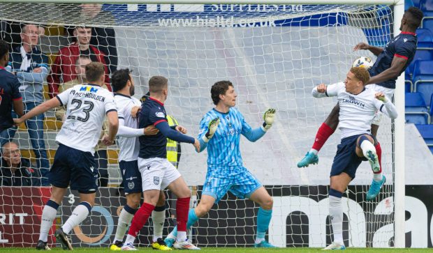 Akil Wright heads Ross County ahead against Dundee. Image: Paul Devlin/SNS.