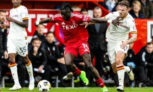 Aberdeen's Pape Gueye, holds off the challenge of Motherwell's Andy Halliday at Pittodrie. Image: SNS