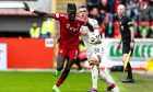 Aberdeen's Pape Gueye and Motherwell's Lennon Miller in action. Image: SNS.