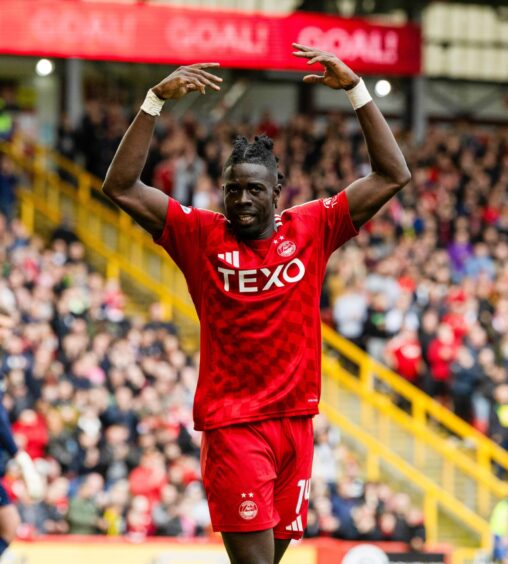 Aberdeen's Pape Gueye celebrates scoring to make it 2-0 against Motherwell. Image: SNS