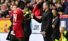 Aberdeen Manager Jimmy Thelin and Pape Gueye  during the win against Motherwell. Image: SNS.