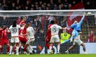 Aberdeen's Dimitar Mitov makes a save to deny Motherwell's Liam Gordon during a 2-1 win. Image: SNS.