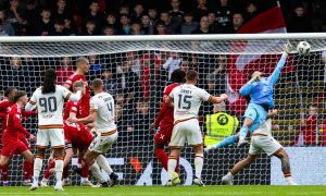 Aberdeen's Dimitar Mitov makes a save to deny Motherwell's Liam Gordon during a 2-1 win. Image: SNS.