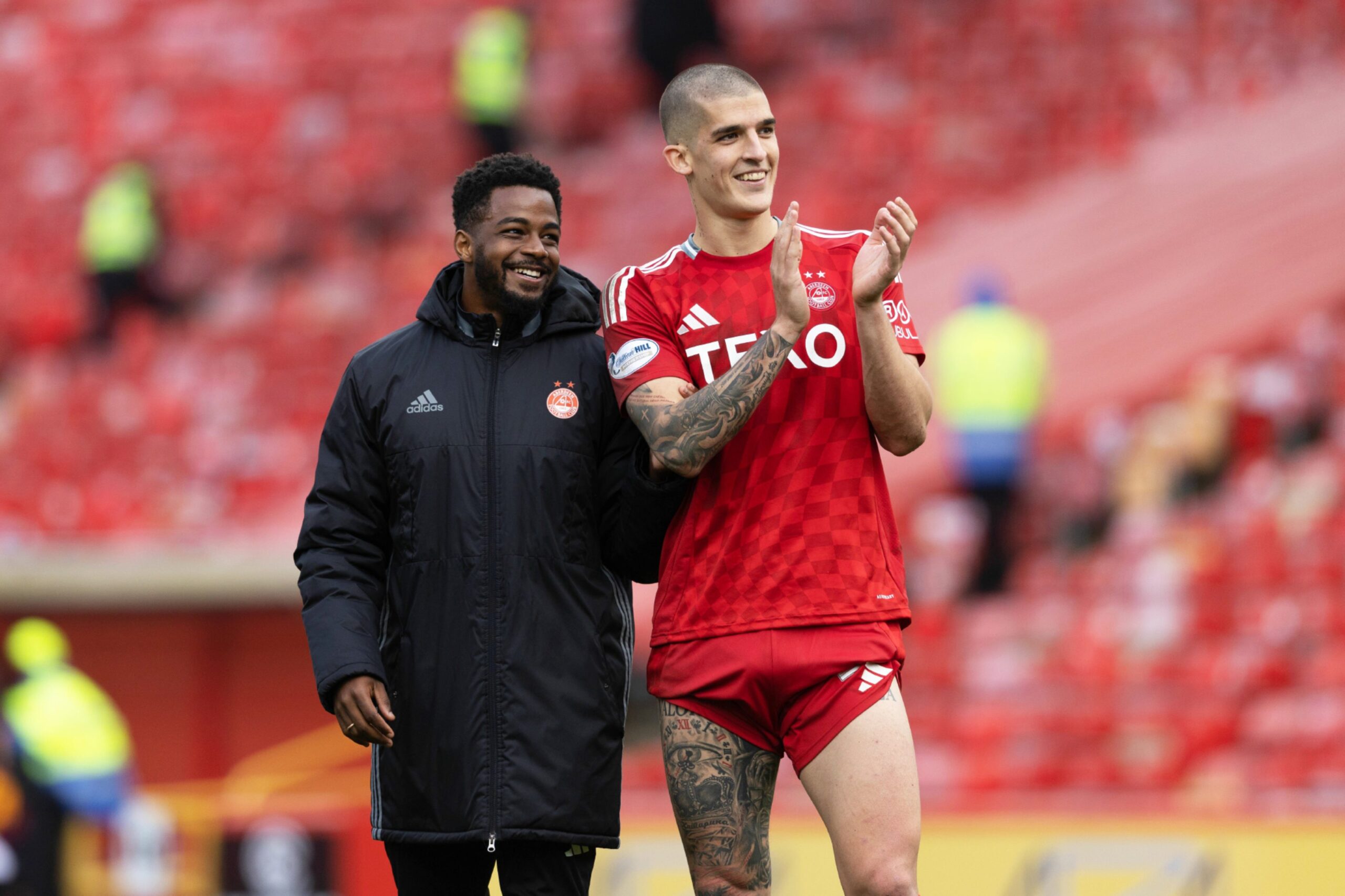 Aberdeen's Duk and Slobodan Rubezic at full-time after the 2-1 win against Motherwell. Image: SNS