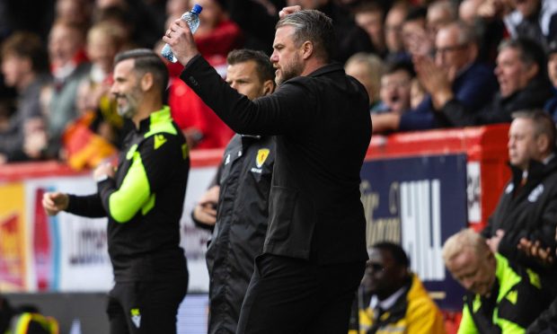 Aberdeen manager Jimmy Thelin  celebrates at full-time after the Dons beat Motherwell in the Premiership. Image: SNS.