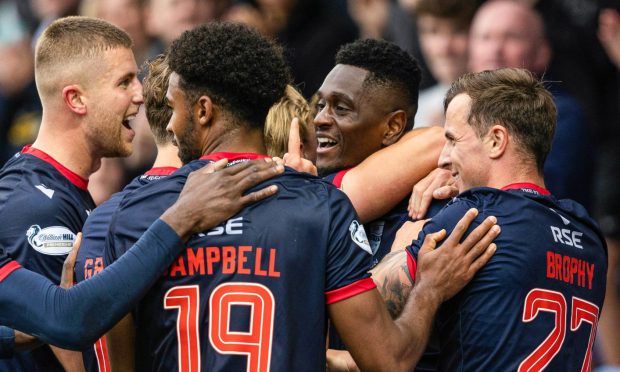 Ross County's Akil Wright celebrates as he scores to make it 3-3 against St Johnstone. Image: SNS.