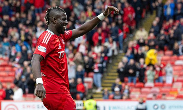 Aberdeen's Pape Habib Gueye celebrates scoring to make it 1-0 against Spartans. Image: SNS