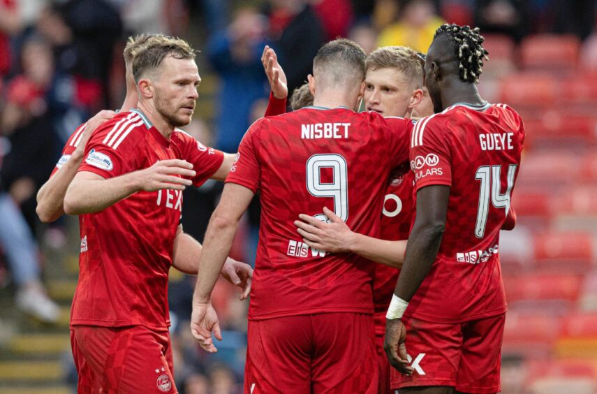 Aberdeen players celebrate after Kevin Nisbet scores to make it 2-0 against Spartans. Image: SNS