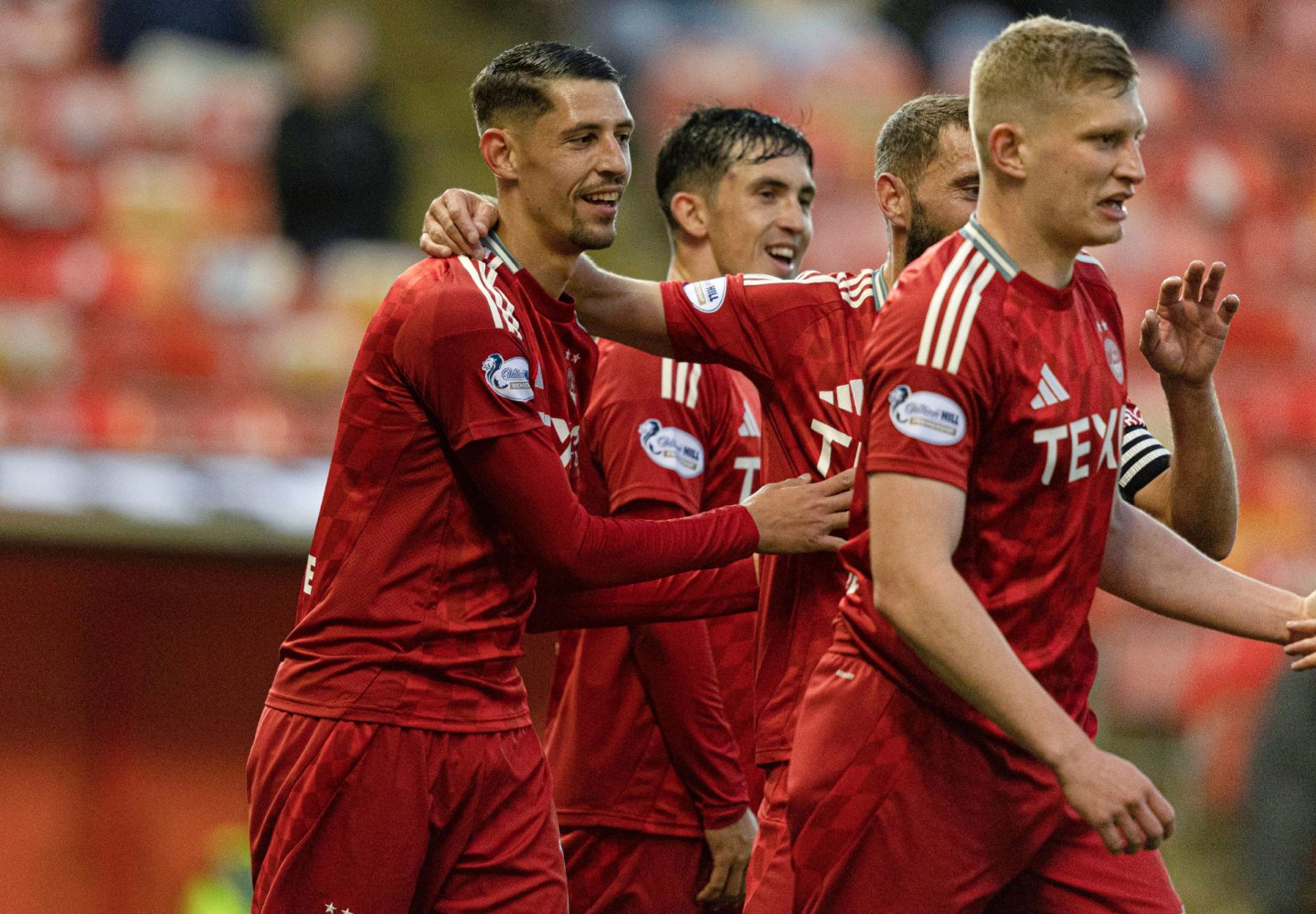 Aberdeen's Ester Sokler (L) celebrates with teammates after scoring to make it 4-0 against Spartans,. Image: SNS