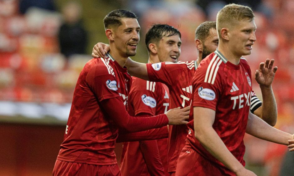 Aberdeen's Ester Sokler (left) celebrates with teammates after scoring to make it 4-0 during the Premier Sports Cup quarter-final win against Spartans. Image: SNS.