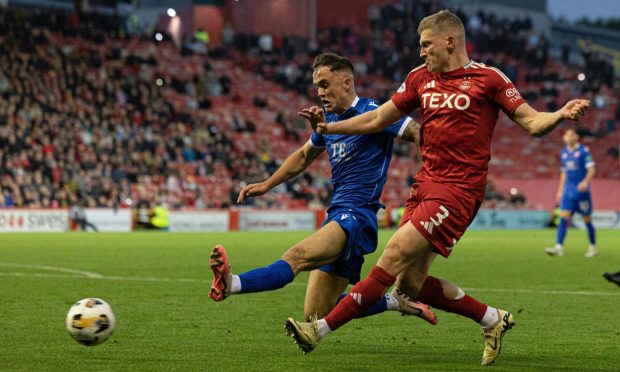 Spartans' Mark Stowe (L) and Aberdeen's Jack MacKenzie in action during a Premier Sports Cup quarter-final match. Image: SNS