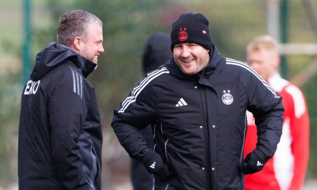 Aberdeen manager Jimmy Thelin (L) and coach Peter Leven (R) during an Aberdeen training session at Cormack Park. Image: SNS