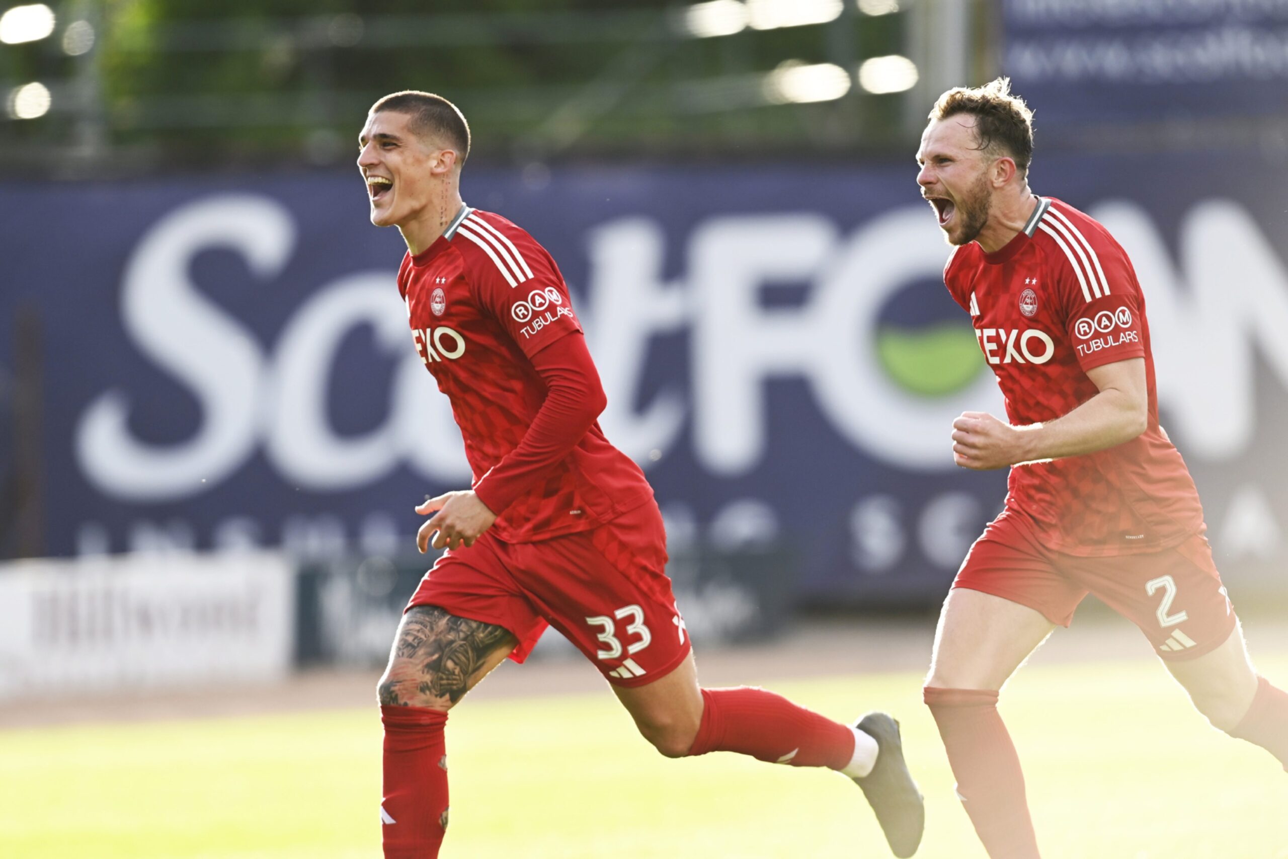 Aberdeen's Slobodan Rubezic and Nicky Devlin celebrate at full-time after beating Dundee 2-1. Image: SNS 