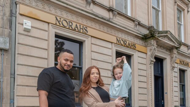 Nathan Davies and his partner Ashlyn with their daughter Norah outside their new business.