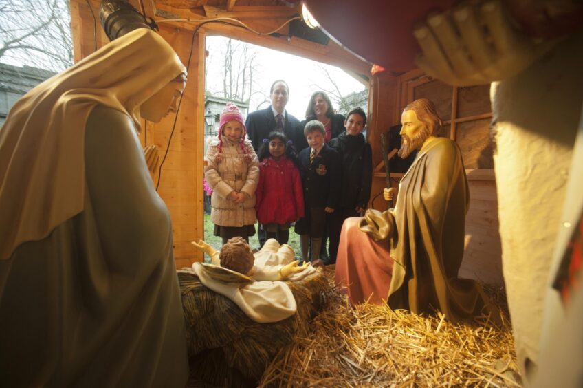 Councillors Martin Greig and Jennifer Stewart (both Lib Dems at the time, 2011) with pupils from Aberdeen's three Catholic primary schools and another from Robert Gordon's College. Image: Aberdeen City Council