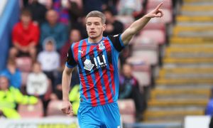 Charlie Gilmour pointing while in action for Caley Thistle.