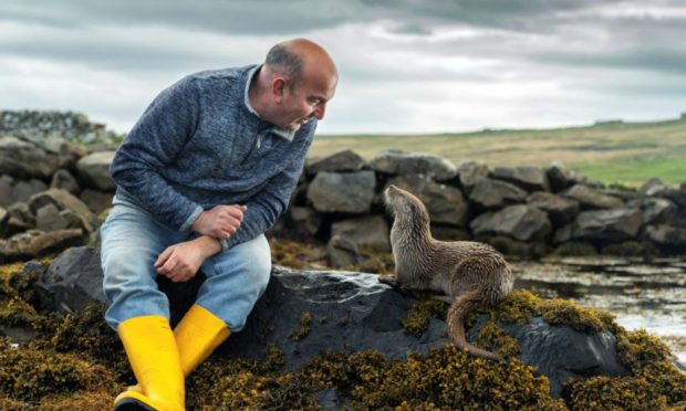 Scenes from Billy & Molly: An Otter Love Story showing Billy Mail with Molly