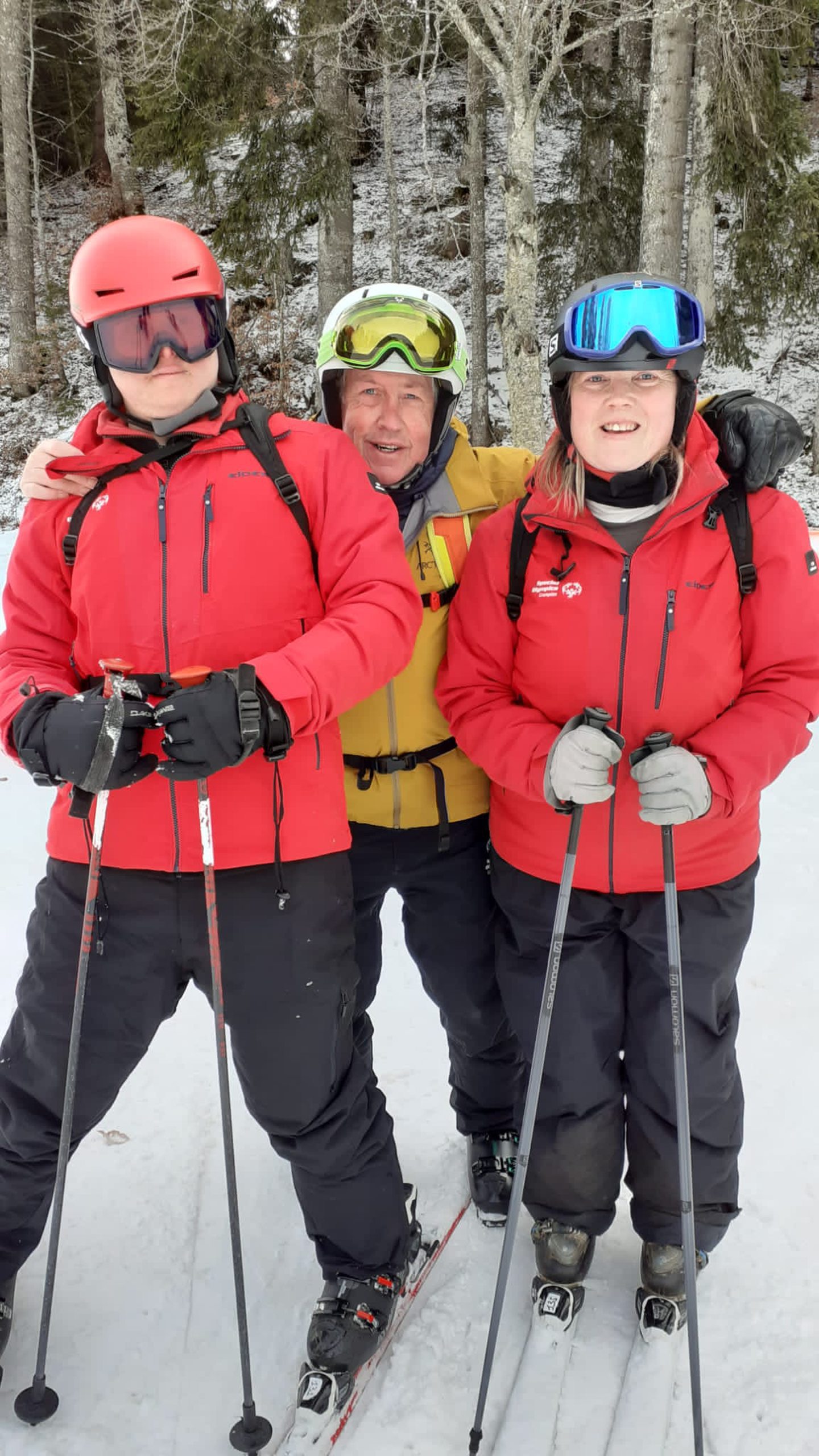 Bob Thow with two Special Olympics athletes. 