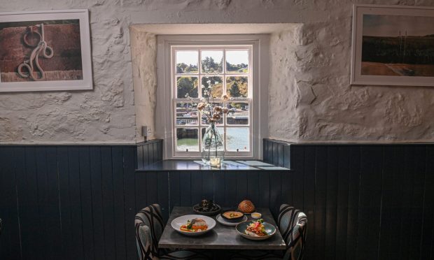 A table at the Tolbooth Seafood Restaurant by a window in Stonehaven