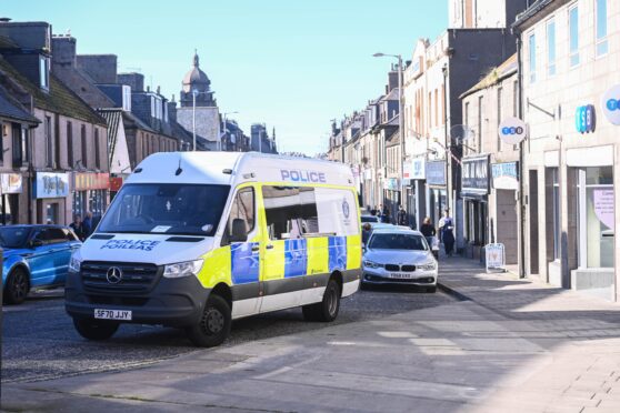 Police locked down Peterhead's Queen Street. Image: Darrell Benns/DC Thomson