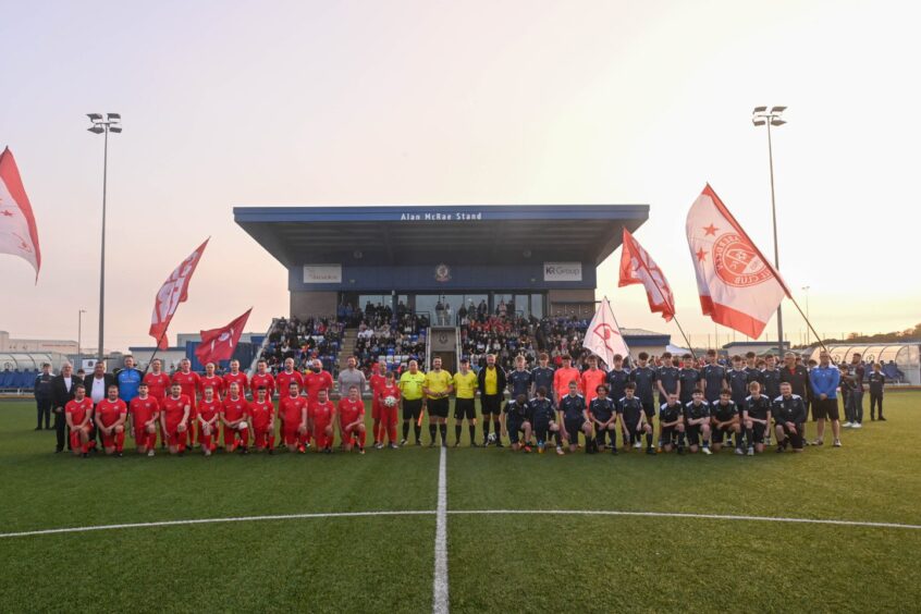 The teams at the start of the charity football match in memory of Ben Bradford.