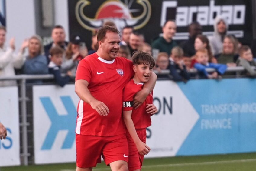 Former Aberdeen player Darren Mackie and Alex Bradford, Ben's little brother, after a goal.