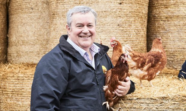 Robert Chapman, of Farmlay, with some of his hens.