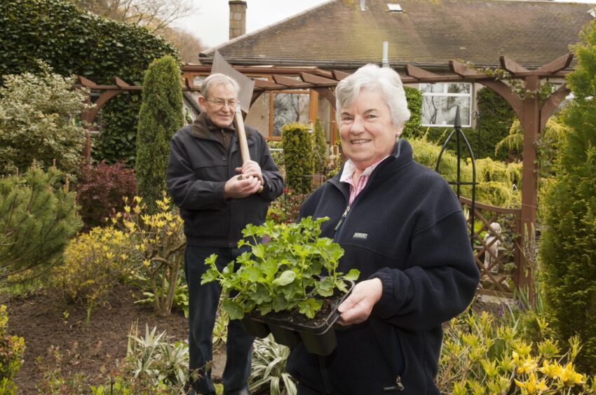 Alice and Alastair Mitchell in their garden