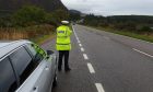 Officer from Highland and Islands Road Policing unit carrying on patrol on NC500.