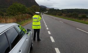 Officer from Highland and Islands Road Policing unit carrying on patrol on NC500.