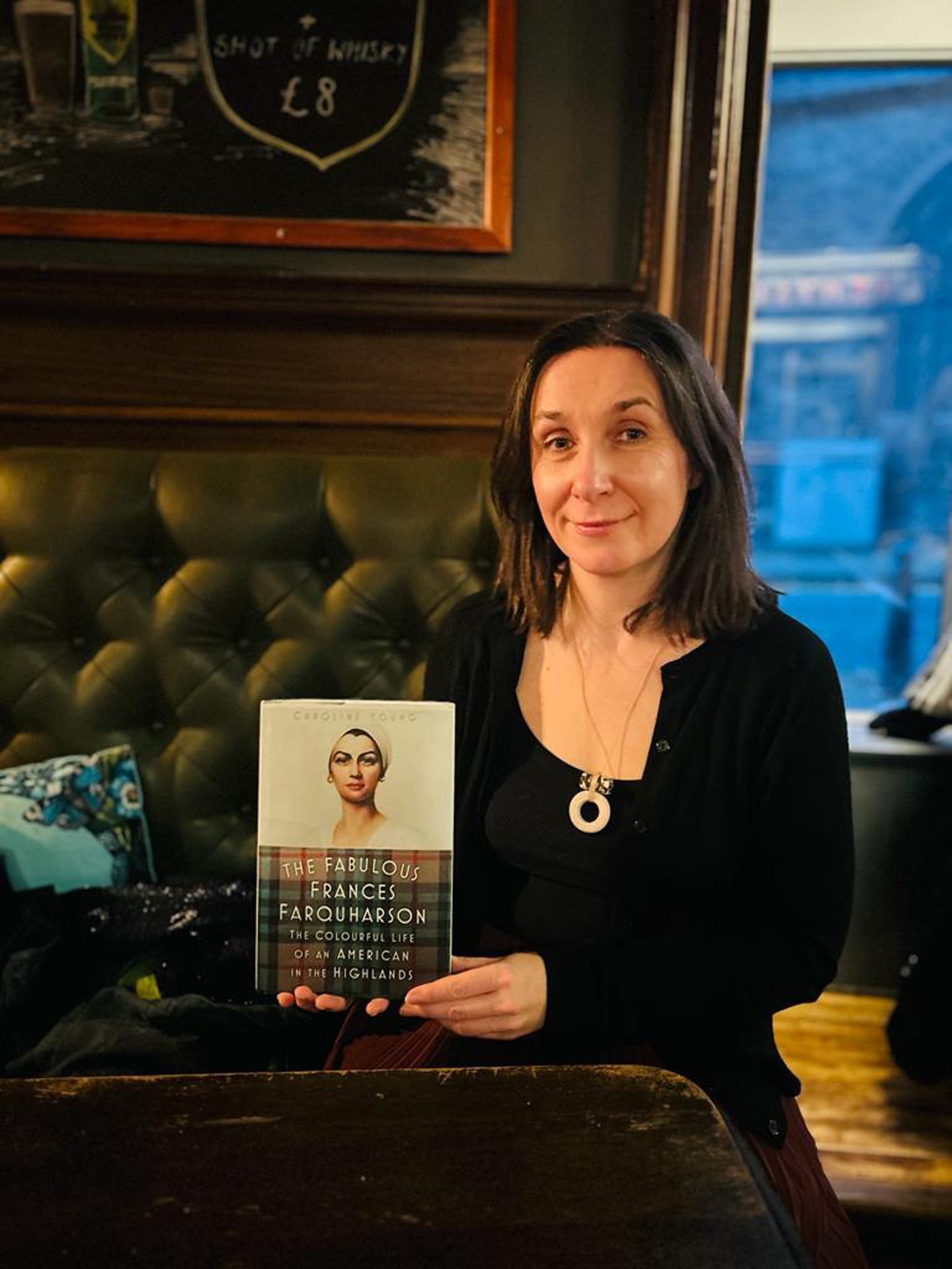 Caroline Young with her book 