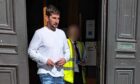 To go with story by Bryan Rutherford. 120mph suspected drink-driver jumped out of vehicle and provoked foot pursuit. Picture shows; Liam Taylor outside Aberdeen Sheriff Court. Aberdeen Sheriff Court. Supplied by DC Thomson Date; 10/09/2024