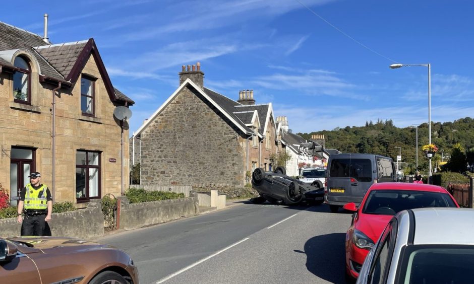 Car flips on to roof in crash outside Oban High School