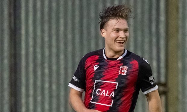 Aidan Wilson, second from left, is congratulated by his Inverurie Locos team-mates after scoring their third goal against Keith. Pictures by Jason Hedges/DCT Media.