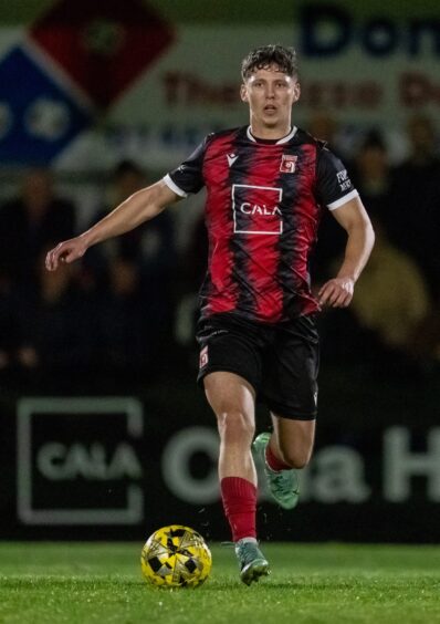 Inverurie Locos' Jay Halliday dribbles with the ball.