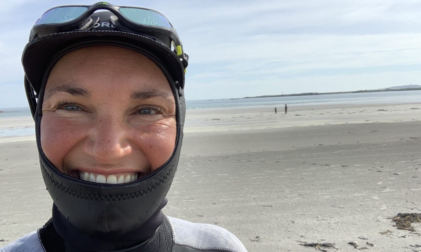 Jen Skinner in a wetsuit on Tiree.