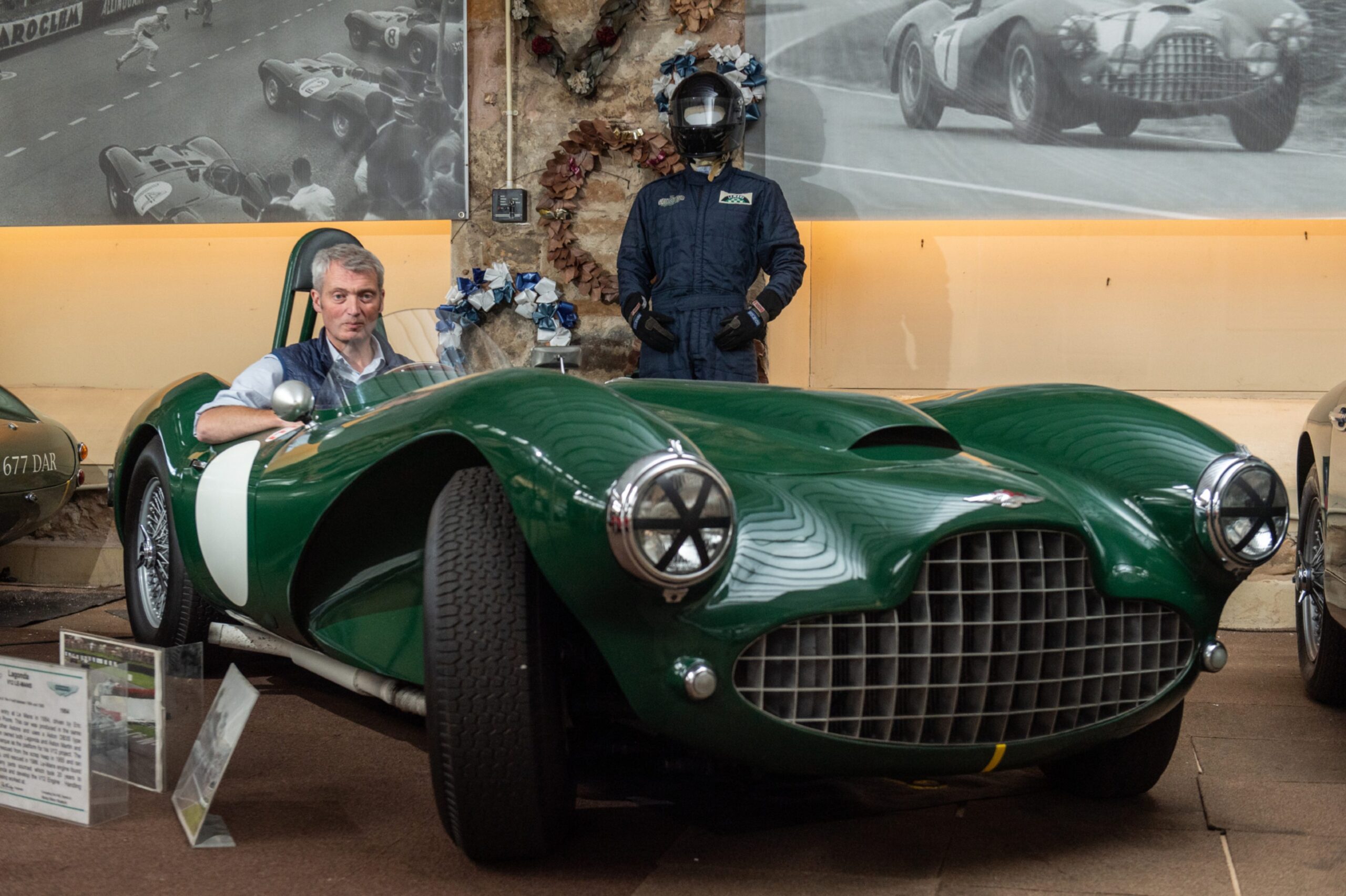 Darren sitting in his Lagonda V12 Le Mans, a stunning green classic car.