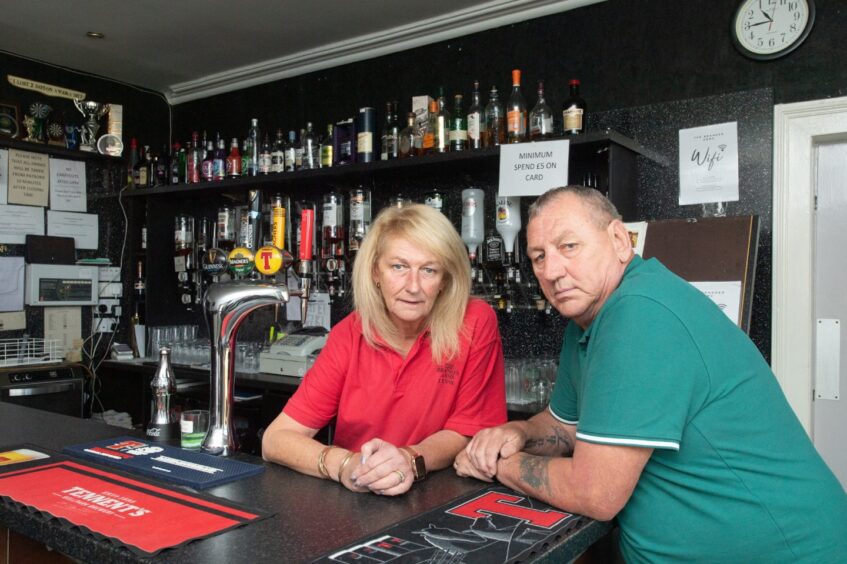 Lynn and Alan Mitchell pictured behind the bar of the Brander Arms 