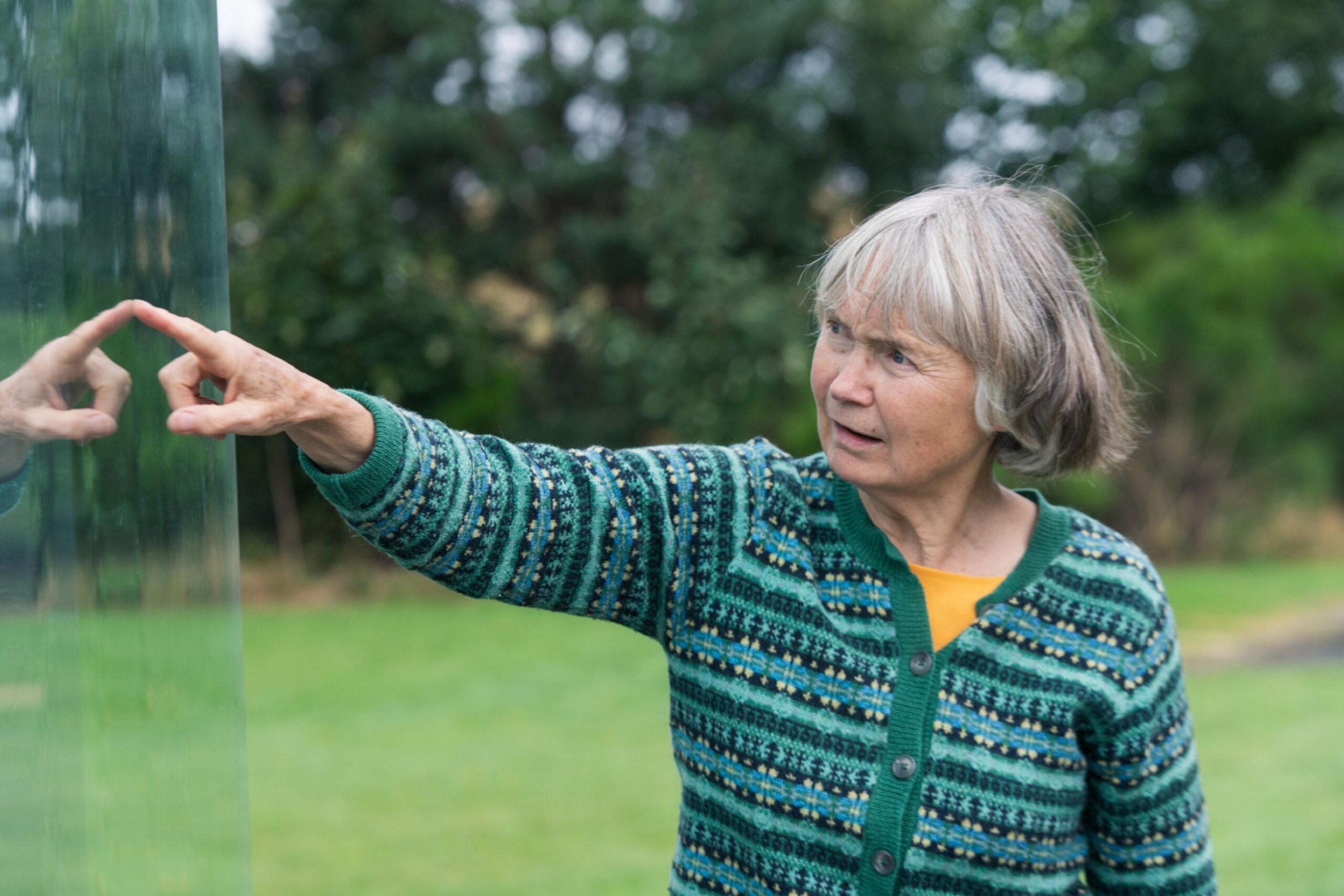 Jane Geddes looking at Sueno's Stone in Forres