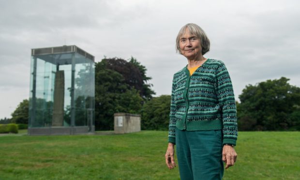 Professor Jane Geddes in front of Sueno's Stone in Forres.