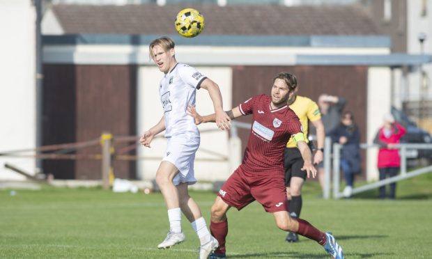 Cole Anderson, left, of Inverurie Locos battles with Keith's James Brownie. Pictures by Jason Hedges/DCT Media.