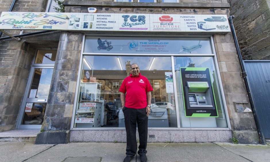 Zafar Ali outside Buckie Furniture. 