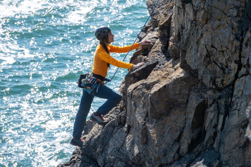 A member of the Granite Girls climbing in Aberdeen