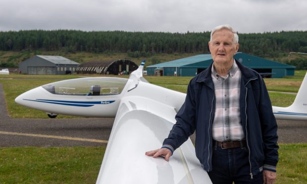 Gordon Young next to glider