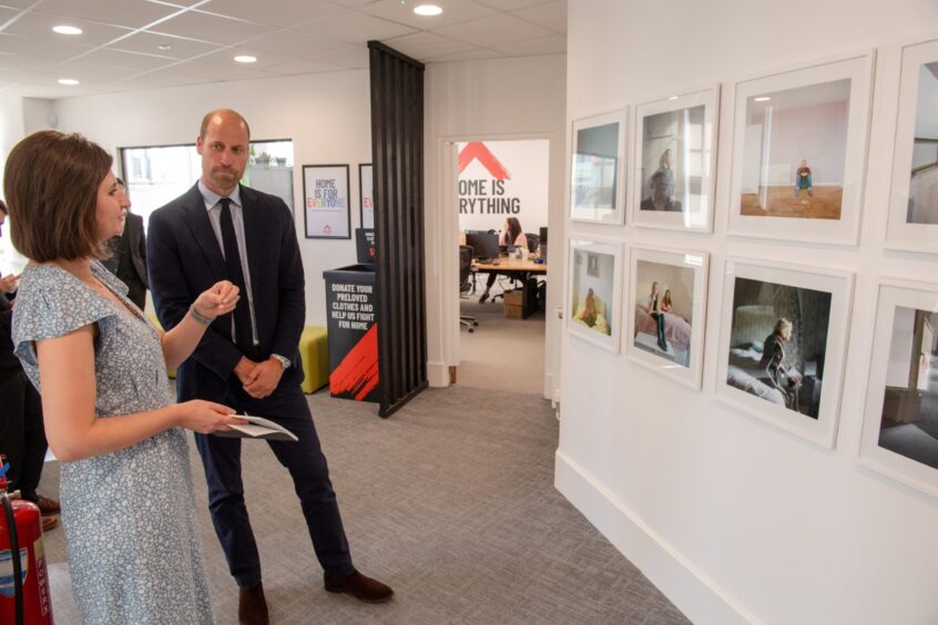 Prince William admiring artwork by Margaret Mitchell