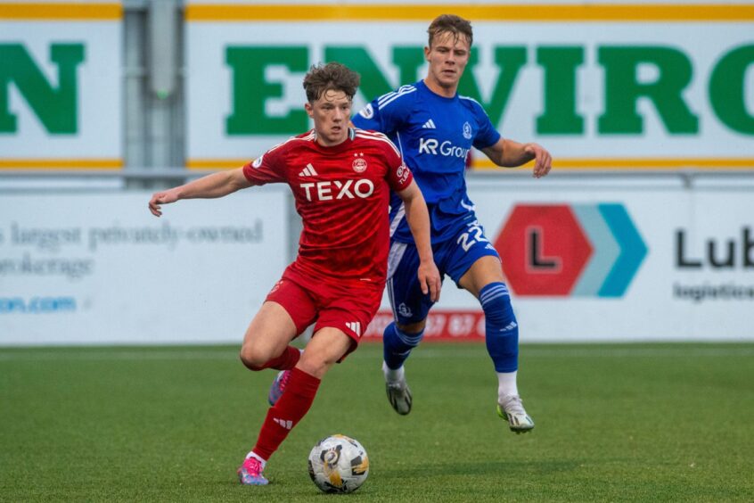 Dylan Lobban playing for Aberdeen and Adam Emslie in Cove Rangers colours during Blair Yule's Cove testimonial in the summer. Image: Kenny Elrick/DC Thomson.