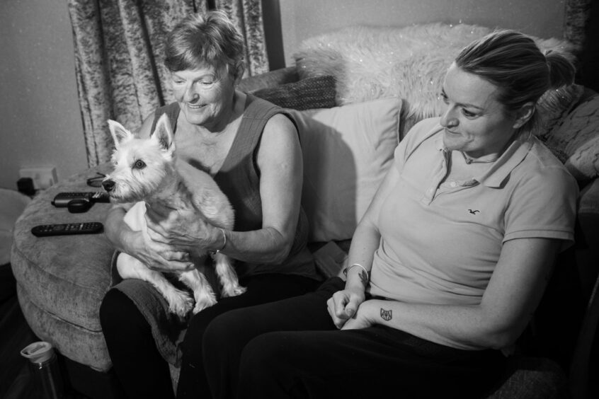 Raac Balnagask: Pam Milne and daughter Polly holding dog Millie.