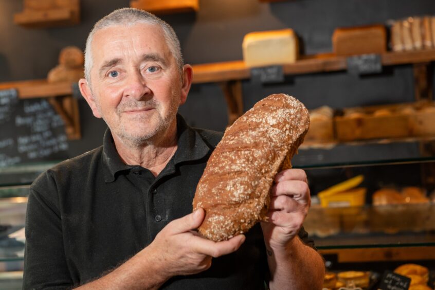 Andy Hutcheon holding load of Balmoral bread